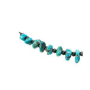 Turquoise howlite beaded necklace with irregular chip-shaped stones detail