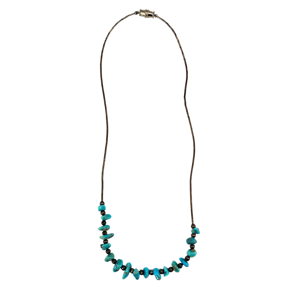 Turquoise howlite beaded necklace with metal clasp on long dark cord