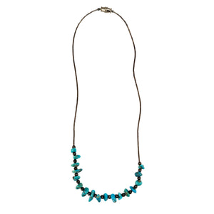 Turquoise howlite beaded necklace with metal clasp on long dark cord