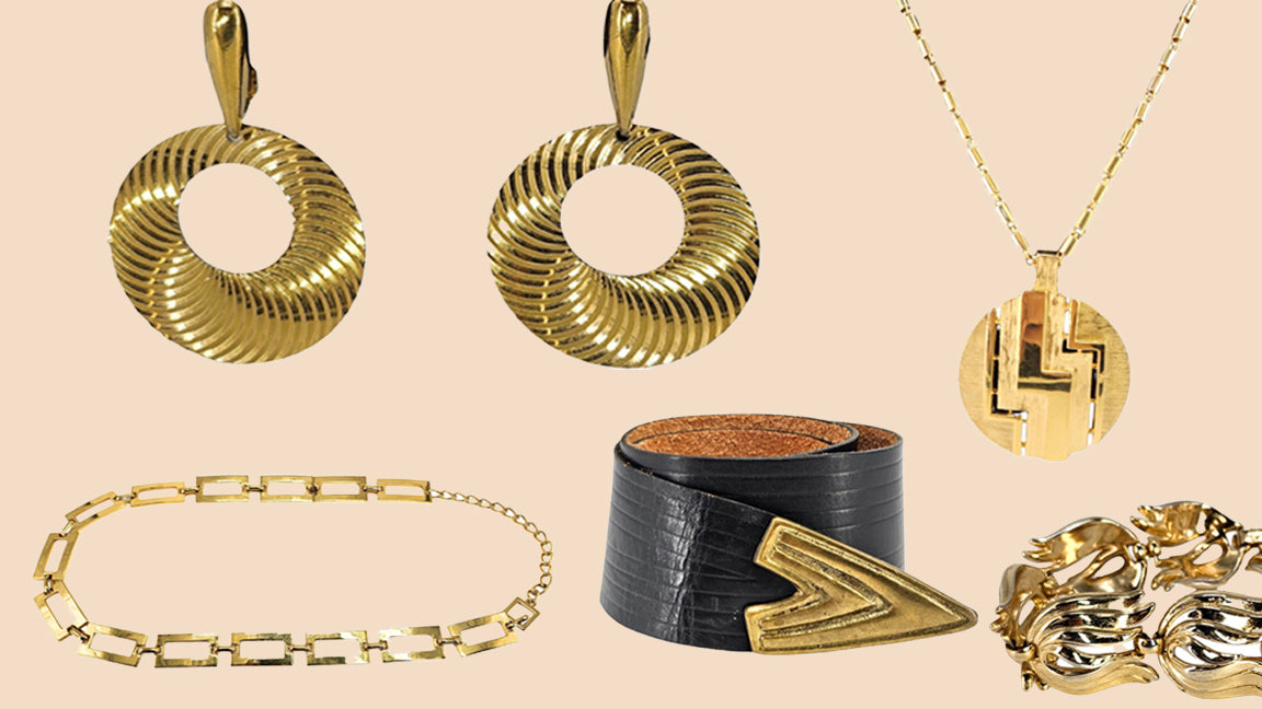 Collection of gold jewelry including pendants, a bracelet, and a ring on a beige background.