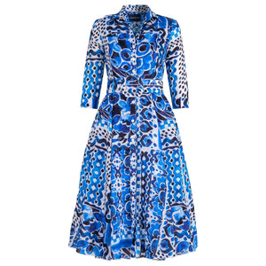 Blue and white patterned dress on a white background