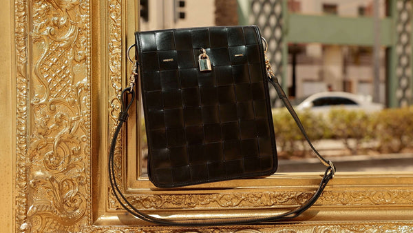 Luxury leather handbags, 100% handmade in Italy, featuring a signature center lock and elegant designs by Madison of Beverly Hills.