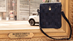 Luxury leather handbags, 100% handmade in Italy, featuring a signature center lock and elegant designs by Madison of Beverly Hills.