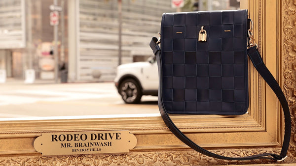 Luxury leather handbags, 100% handmade in Italy, featuring a signature center lock and elegant designs by Madison of Beverly Hills.
