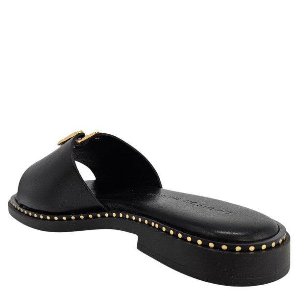Black sandal with gold studs on a white background
