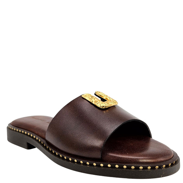 Brown sandal with gold embellishments on a white background