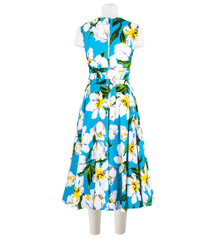 A knee-length dress with a collared neckline, three-quarter sleeves, and a flared skirt. Features a bold allover abstract pattern and fitted waist.