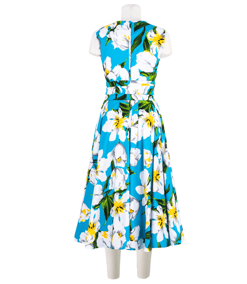 A knee-length dress with a collared neckline, three-quarter sleeves, and a flared skirt. Features a bold allover abstract pattern and fitted waist.