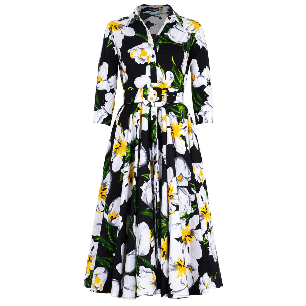 Floral dress with white flowers and green leaves on a black background