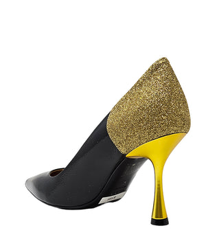 Pointed-toe pump handcrafted in Italy with a high heel, glossy finish, and a glitter-accented heel counter. Features a sculptural stiletto heel and metallic insole. Shown from multiple angles against a clean background