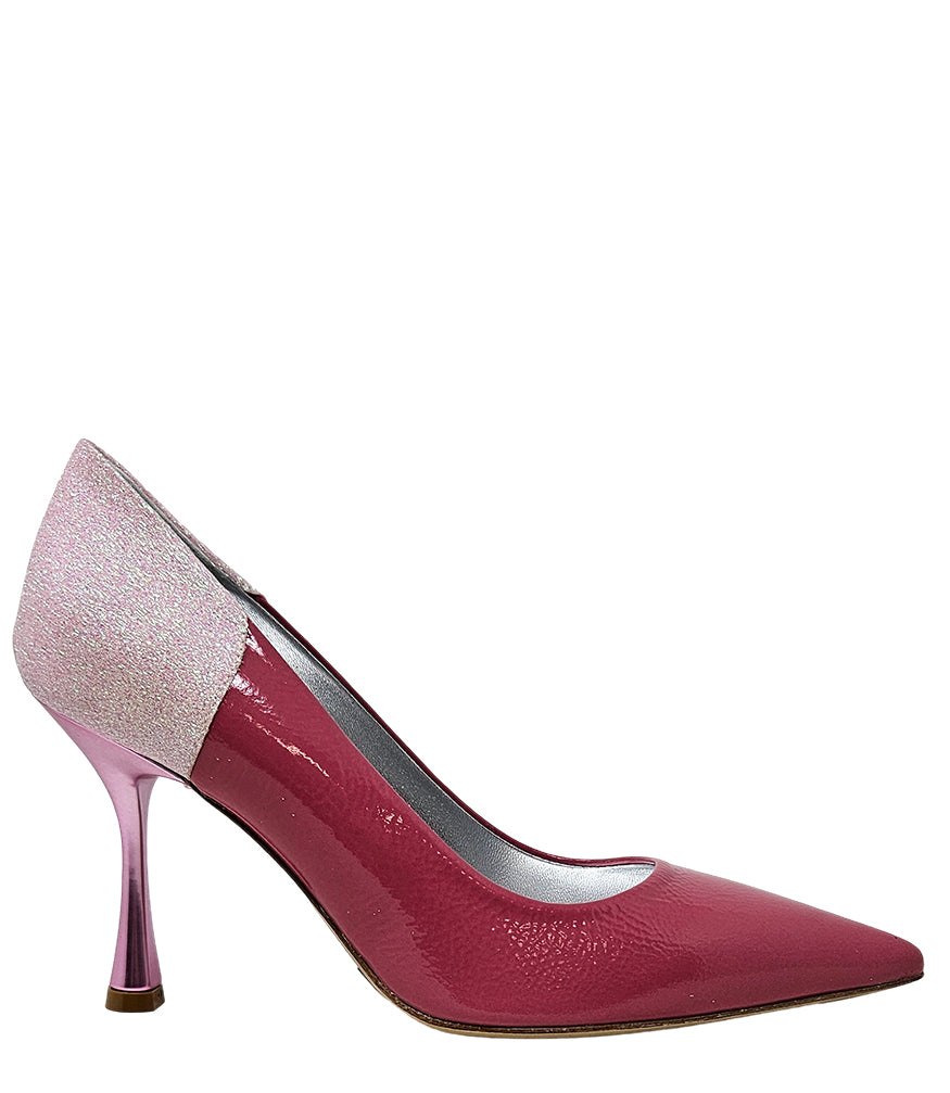 Pointed-toe pump handcrafted in Italy with a high heel, glossy finish, and a glitter-accented heel counter. Features a sculptural stiletto heel and metallic insole. Shown from multiple angles against a clean background