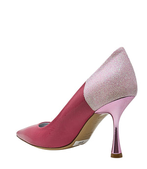 Pointed-toe pump handcrafted in Italy with a high heel, glossy finish, and a glitter-accented heel counter. Features a sculptural stiletto heel and metallic insole. Shown from multiple angles against a clean background