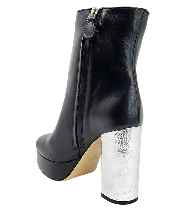 "High-heel ankle boot crafted from smooth premium leather with a sleek rounded toe, an inner side zipper for easy wear, a supportive leather-wrapped platform, and a sturdy metallic block heel. Designed with a soft leather lining and a durable leather sole