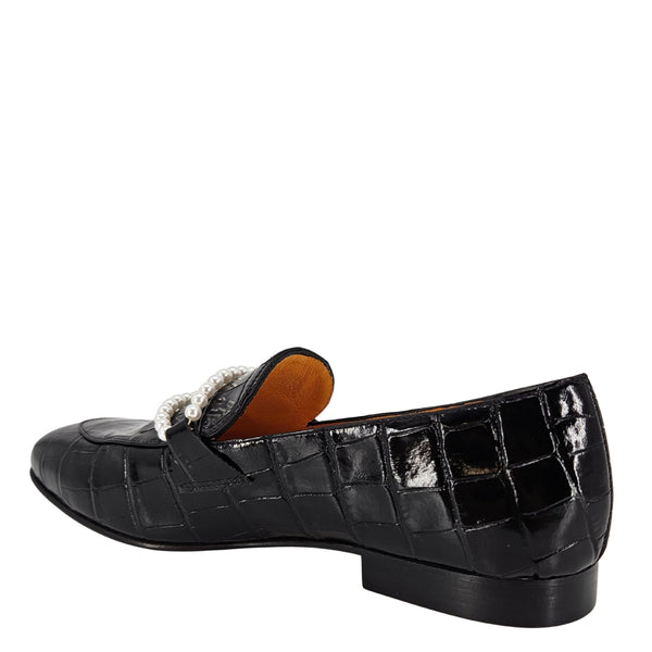 Black crocodile-patterned loafer shoe on a white background