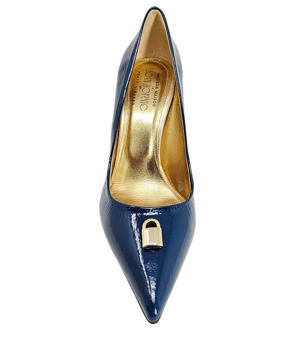Pointed-toe stiletto pump with a sleek, glossy finish, mid-height heel, and gold lock embellishment at the toe. Features a sculpted silhouette and cushioned interior.