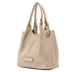 Beige handbag with a visible brand label on a white background