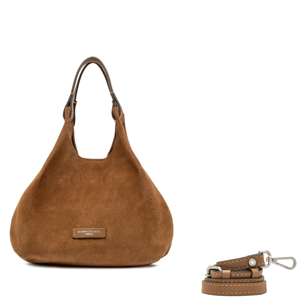 Brown handbag with matching keychain on a white background