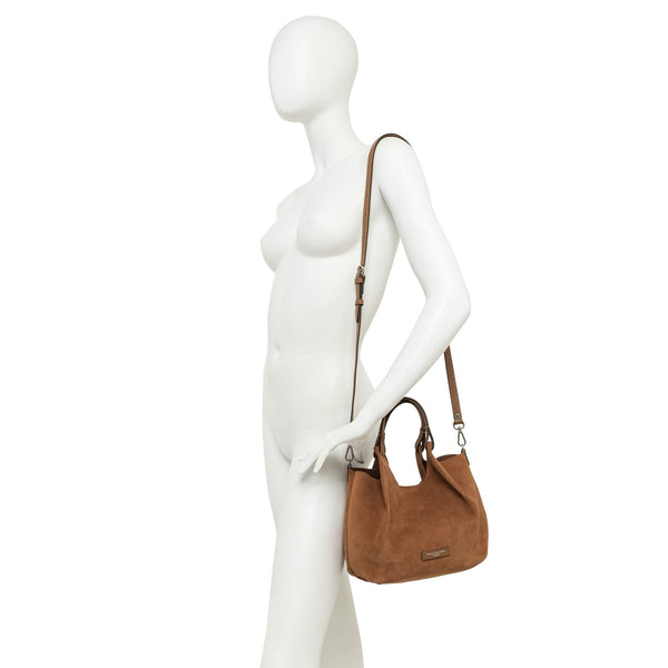 Brown handbag on a white mannequin against a white background