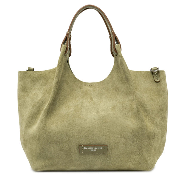 Green handbag with a visible brand label on a white background