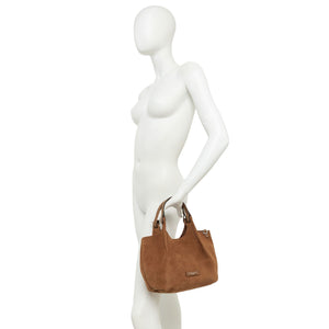 Mannequin holding a brown handbag on a white background