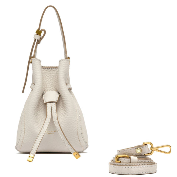 White leather handbag with matching strap and keychain on a white background