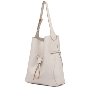 Beige handbag with a strap on a white background