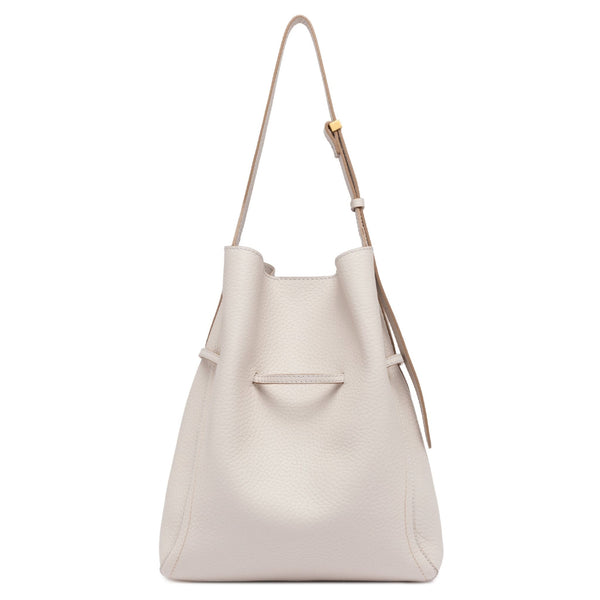 White leather handbag with a strap on a white background