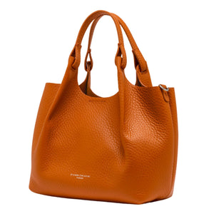 Orange leather hobo bag with dual top handles and structured front panel