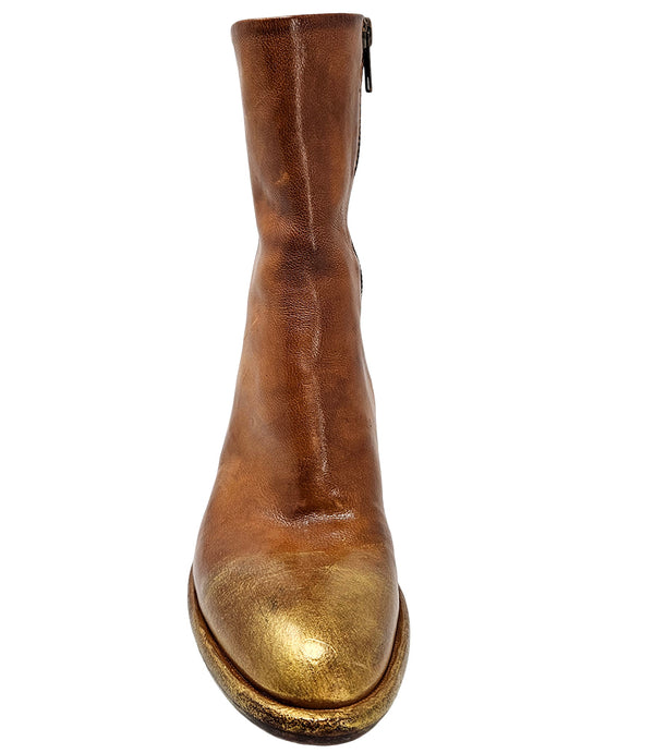 Mid-heel ankle boot crafted from premium leather with a softly rounded toe, artisanal distressed detailing at the toe and heel, and a stacked block heel. Features a full side zipper for easy entry, a leather-lined interior for comfort, and a durable leath
