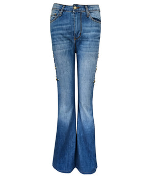Flared-leg pants made in Italy with a mid-rise fit, featuring front and back pockets and star-shaped accents on the hip, lower leg, and back pocket. Displayed from multiple angles against a clean background
