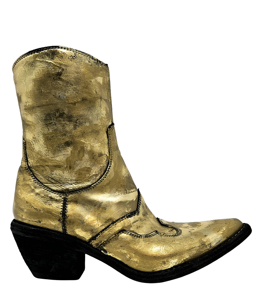 Mid-calf western-style boot featuring a distressed metallic finish, pointed toe, angled block heel, and contrast stitching. Designed with decorative panel overlays and a side zipper closure.
