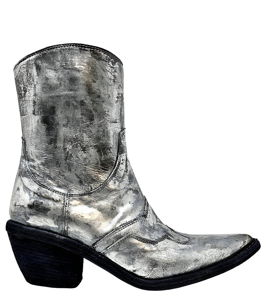 Mid-calf western-style boot featuring a distressed metallic finish, pointed toe, angled block heel, and contrast stitching. Designed with decorative panel overlays and a side zipper closure.