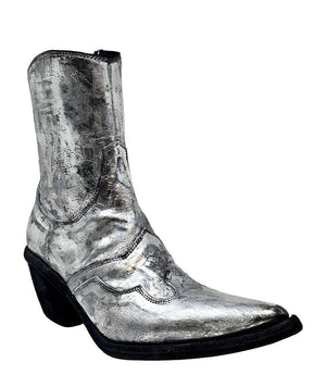 Mid-calf western-style boot featuring a distressed silver metallic finish, pointed toe, angled block heel, and contrast stitching. Designed with decorative panel overlays and a side zipper closure - front side view