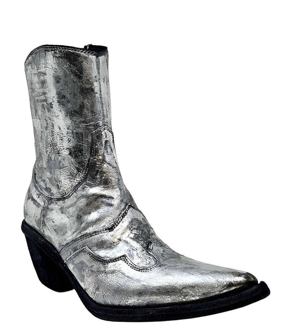 Mid-calf western-style boot featuring a distressed silver metallic finish, pointed toe, angled block heel, and contrast stitching. Designed with decorative panel overlays and a side zipper closure - front side view