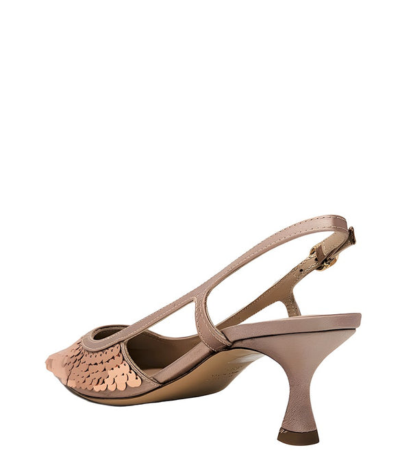 Handcrafted slingback shoe with sequin embellishments, low heel, and pointed toe design. Features an adjustable ankle strap and a textured surface for added visual interest