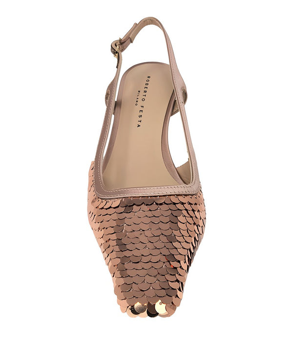 Handcrafted slingback shoe with sequin embellishments, low heel, and pointed toe design. Features an adjustable ankle strap and a textured surface for added visual interest