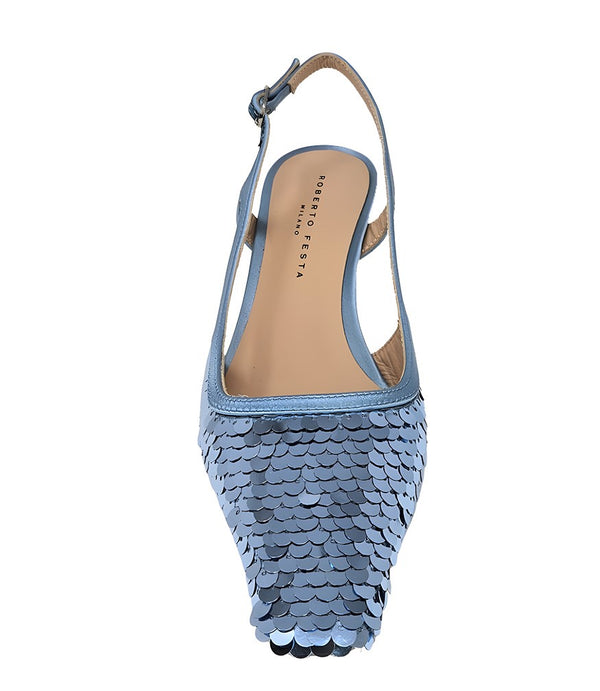 Handcrafted slingback shoe with sequin embellishments, low heel, and pointed toe design. Features an adjustable ankle strap and a textured surface for added visual interest
