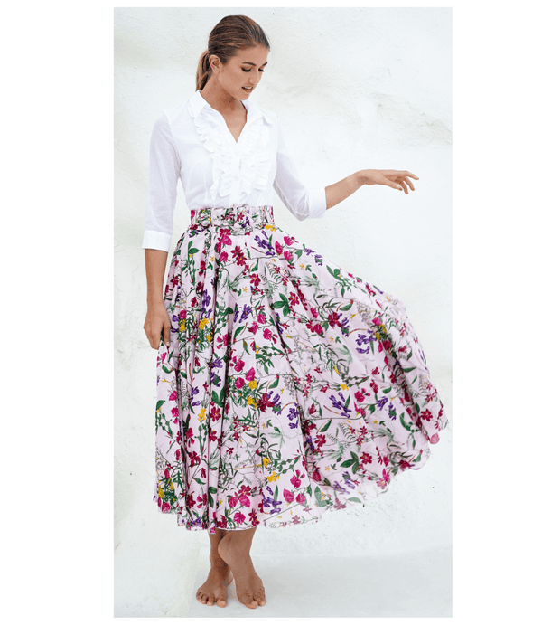 A knee-length dress with a collared neckline, three-quarter sleeves, and a flared skirt. Features a bold allover abstract pattern and fitted waist.