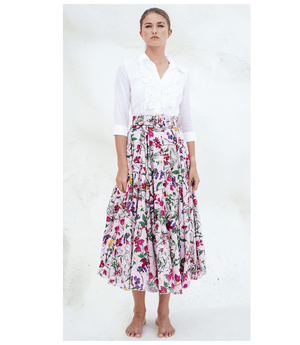 A knee-length dress with a collared neckline, three-quarter sleeves, and a flared skirt. Features a bold allover abstract pattern and fitted waist.