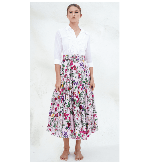 A knee-length dress with a collared neckline, three-quarter sleeves, and a flared skirt. Features a bold allover abstract pattern and fitted waist.