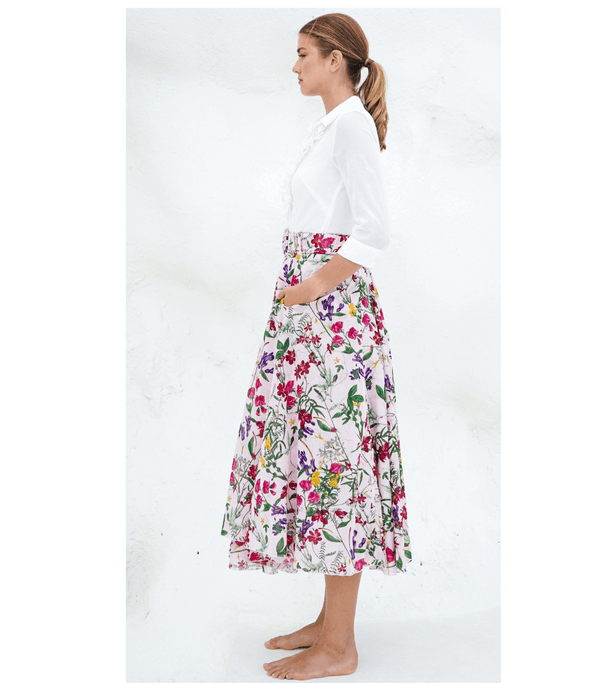 A knee-length dress with a collared neckline, three-quarter sleeves, and a flared skirt. Features a bold allover abstract pattern and fitted waist.