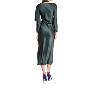 Green satin dress worn by a model on a white background