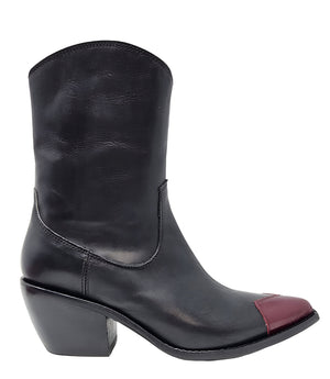 Mid-calf leather boot with block heel, side zipper, and contrasting heart-shaped toe cap. Features a structured silhouette with a pointed toe and minimal seam lines.