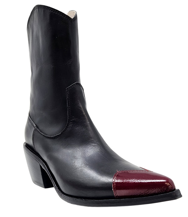 Mid-calf leather boot with block heel, side zipper, and contrasting heart-shaped toe cap. Features a structured silhouette with a pointed toe and minimal seam lines.