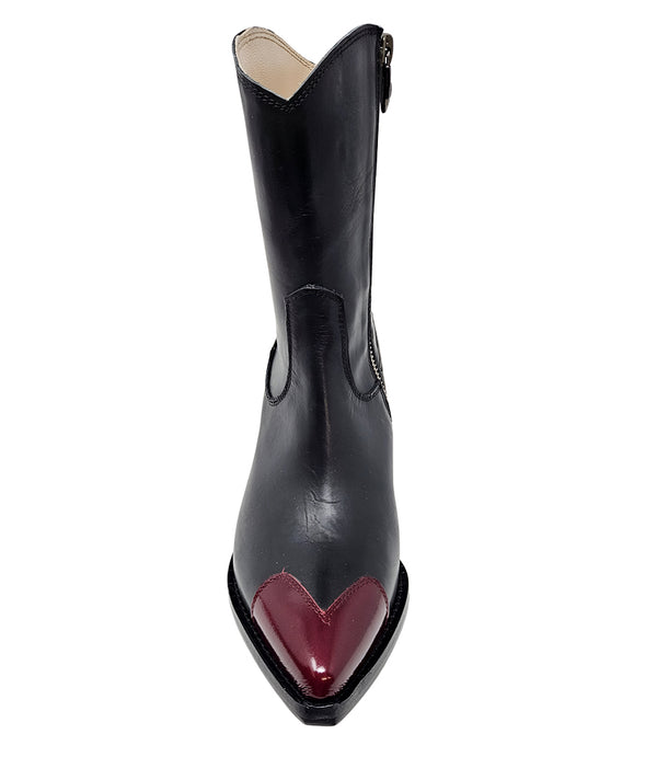 Mid-calf leather boot with block heel, side zipper, and contrasting heart-shaped toe cap. Features a structured silhouette with a pointed toe and minimal seam lines.