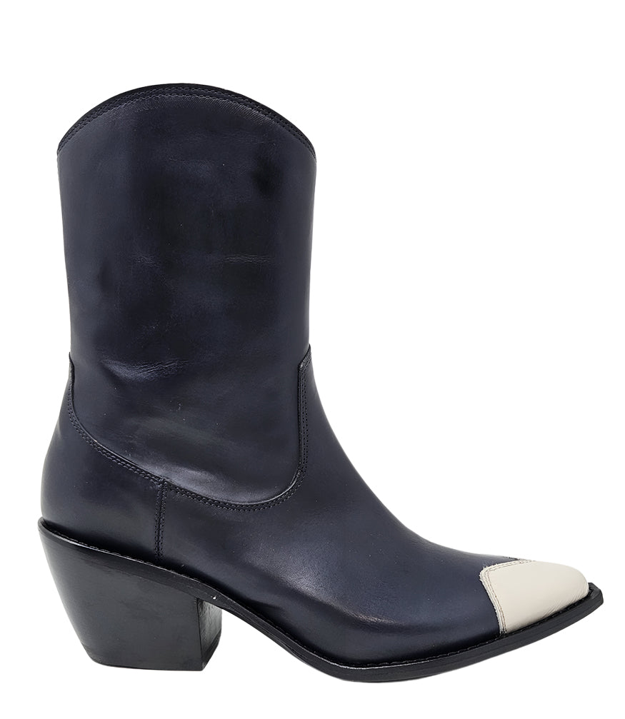 Mid-calf leather boot with block heel, side zipper, and contrasting heart-shaped toe cap. Features a structured silhouette with a pointed toe and minimal seam lines.
