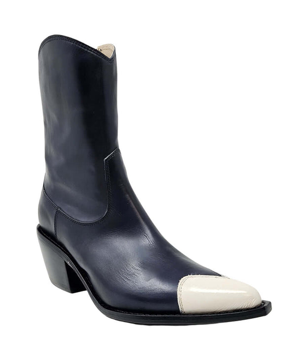 Mid-calf leather boot with block heel, side zipper, and contrasting heart-shaped toe cap. Features a structured silhouette with a pointed toe and minimal seam lines.