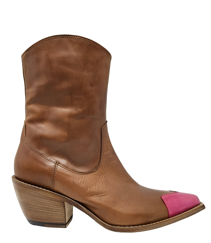 Mid-calf leather boot with block heel, side zipper, and contrasting heart-shaped toe cap. Features a structured silhouette with a pointed toe and minimal seam lines.
