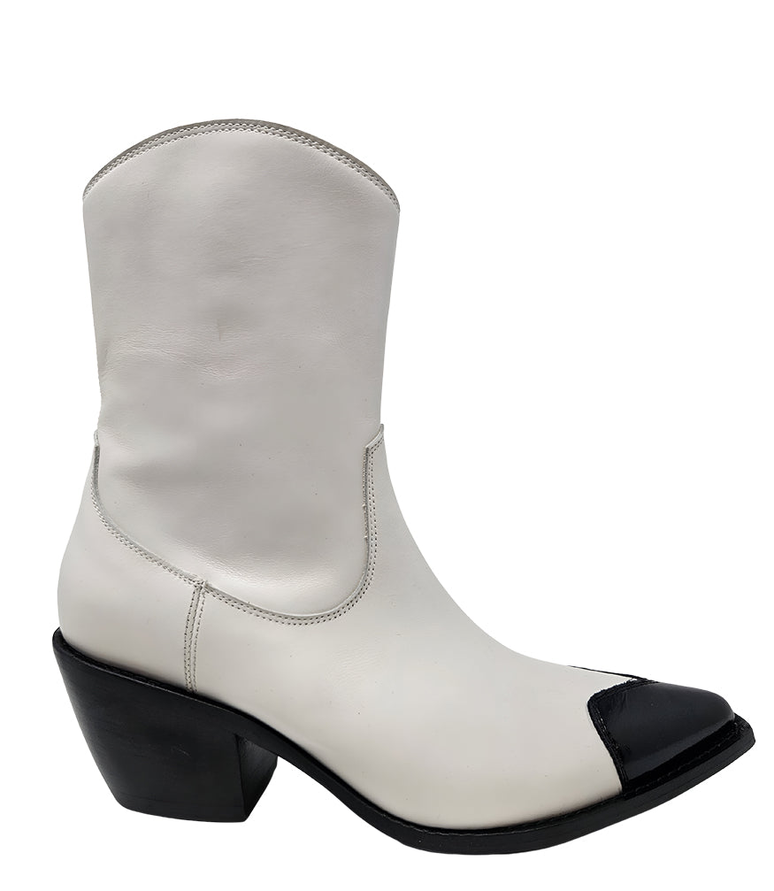 Mid-calf leather boot with block heel, side zipper, and contrasting heart-shaped toe cap. Features a structured silhouette with a pointed toe and minimal seam lines.