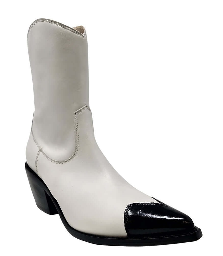 White ankle boot with glossy black heart-shaped toe and chunky black heel